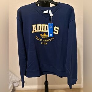 ADIDAS ORIGINALS
GFX CREW SWEAT long sleeve V neck in dark blue. Sz X-Large. NWT